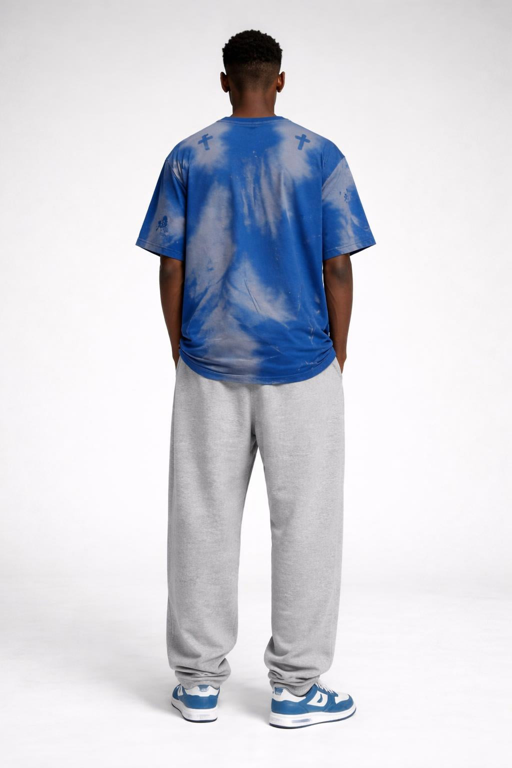 Back pose of the model wearing Worship-Inspired Apparel Tee