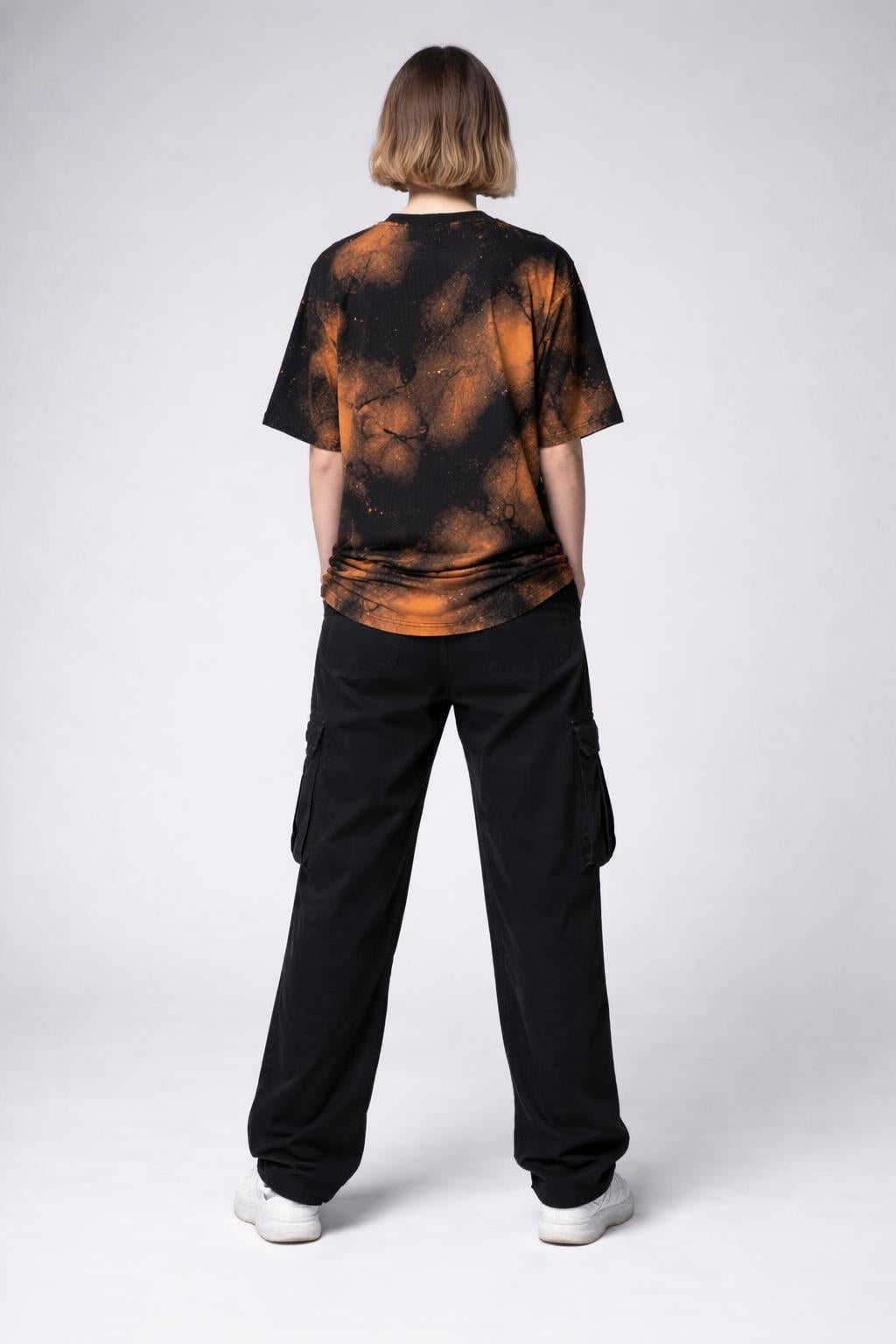 Back pose of the model wearing Redeemed Radiance Tee