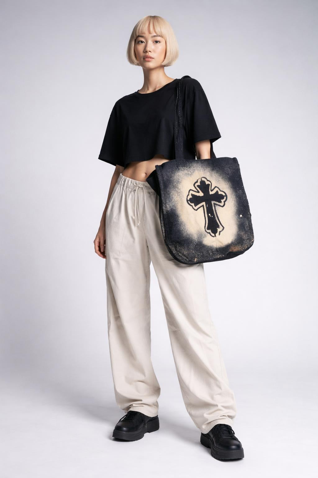 Full body view of the model wearing Large Cross Tote Bag