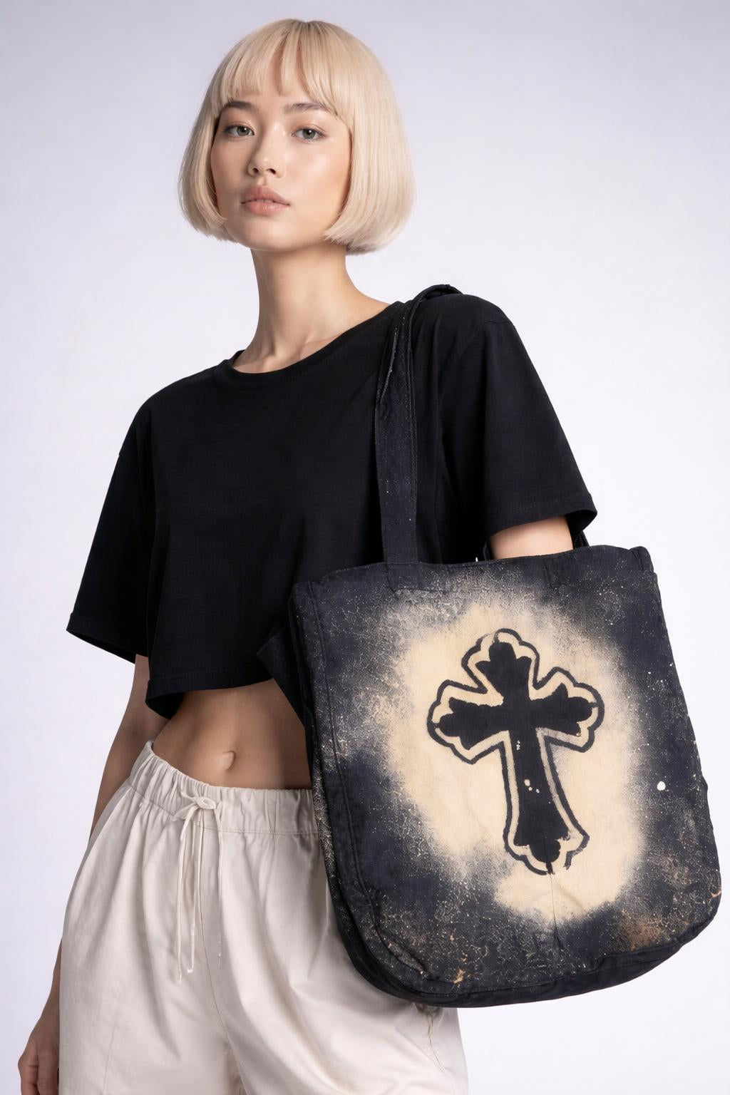 Close-up of the model wearing Large Cross Tote Bag